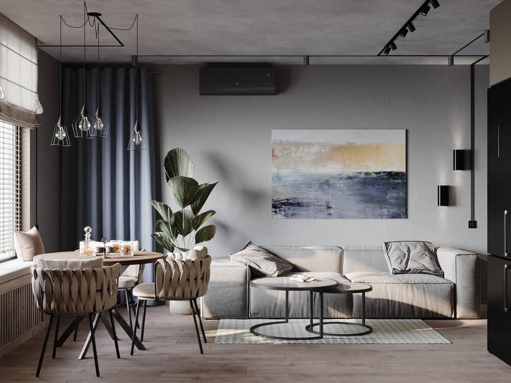 Không gian phòng khách hiện đại với bàn trà kim loại và ánh sáng tự nhiên mang lại cảm giác thoáng đãng