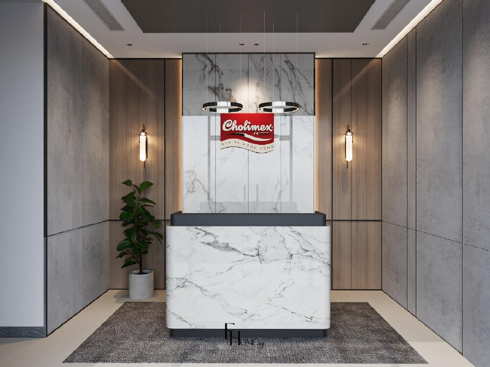 Khu vực lễ tân chuyên nghiệp với quầy tiếp đón nổi bật và vách logo đúng chuẩn nhận diện
