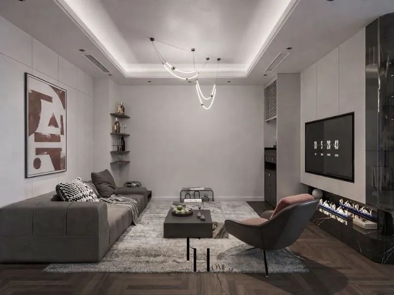 Phòng khách chung cư 80m2 tông xám khói trần hộp đèn hắt hộc lửa điện ghế sofa xám ghế đơn hồng đất