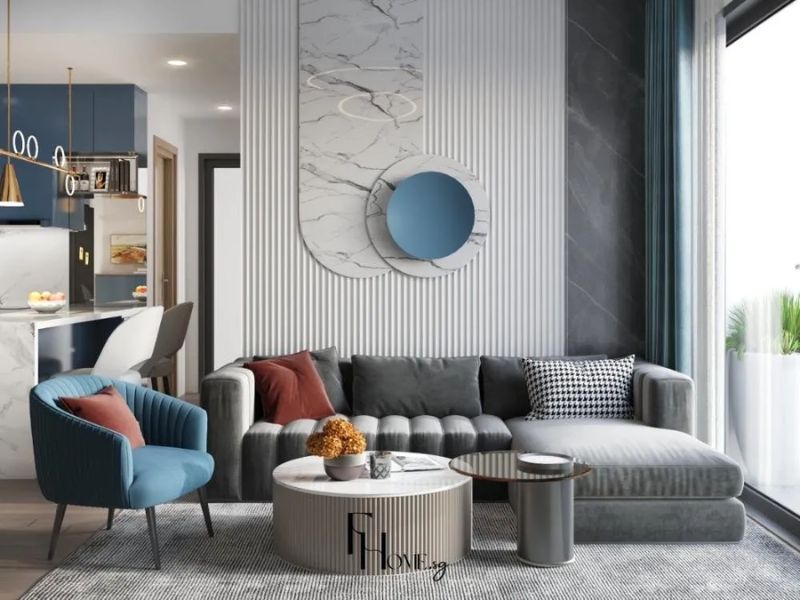Phòng khách liền bếp tủ bếp xanh navy quầy bar đá cẩm thạch ghế sofa xám nhung ghế đơn xanh dương
