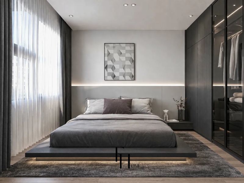 Phòng ngủ phong cách Hiện đại giường platform xám đèn LED gầm, tủ âm kính khung đen lộ walk-in closet và đèn LED viền đầu giường trong thiết kế nội thất căn hộ 90m2