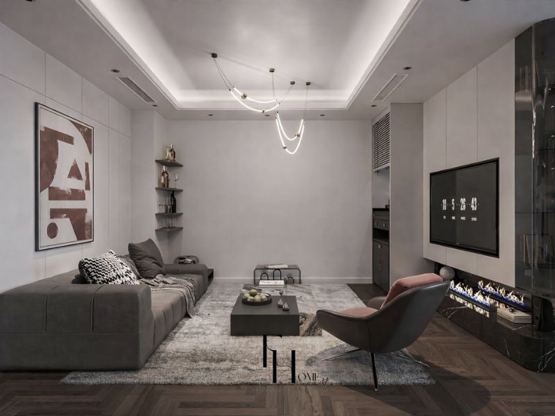 Phòng khách chung cư 50m2 phong cách Luxury với trần giật cấp LED viền trắng, sofa xám than, đèn thả dây uốn nghệ thuật đầu đồng và lò sưởi cồn sinh học tích hợp tường TV