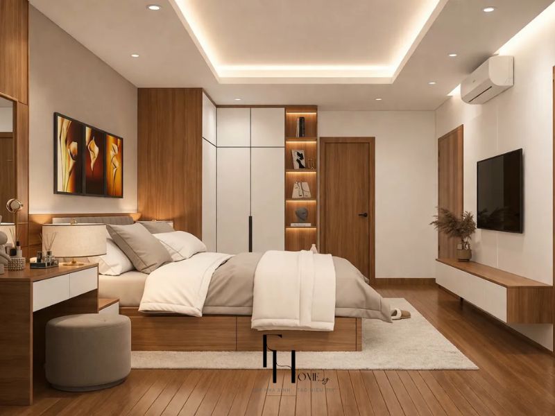 Phòng ngủ master tủ âm tường gỗ trắng kết hợp kệ LED bàn trang điểm và TV treo tường trong thiết kế nội thất căn hộ 90m2