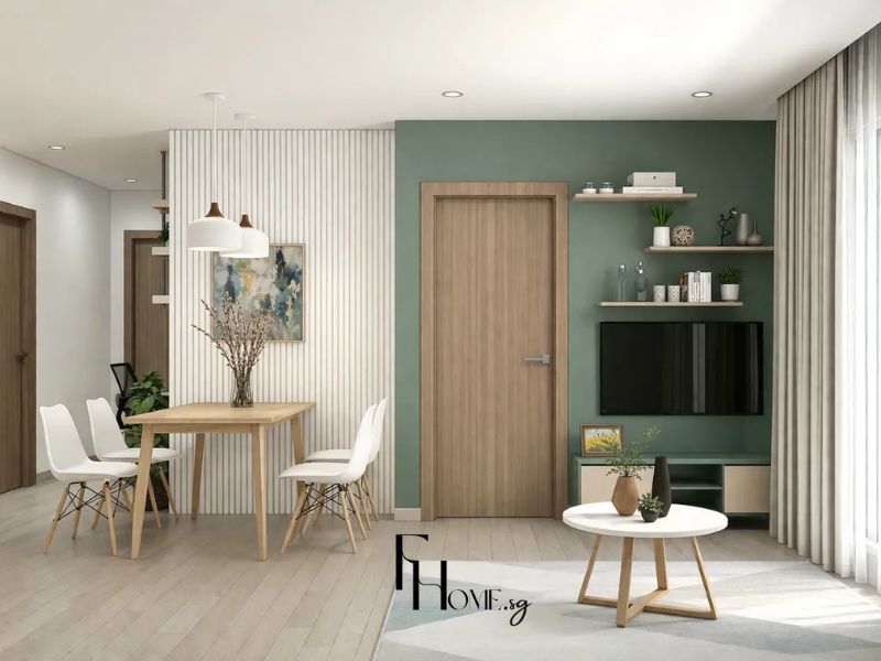 Thiết kế nội thất phòng khách căn hộ chung cư 70m2 phong cách Scandinavian – tường accent xanh lá, kệ TV gỗ trắng, bàn tròn chân gỗ, bàn ăn gỗ ghế trắng, vách lam trắng, đèn thả trắng 