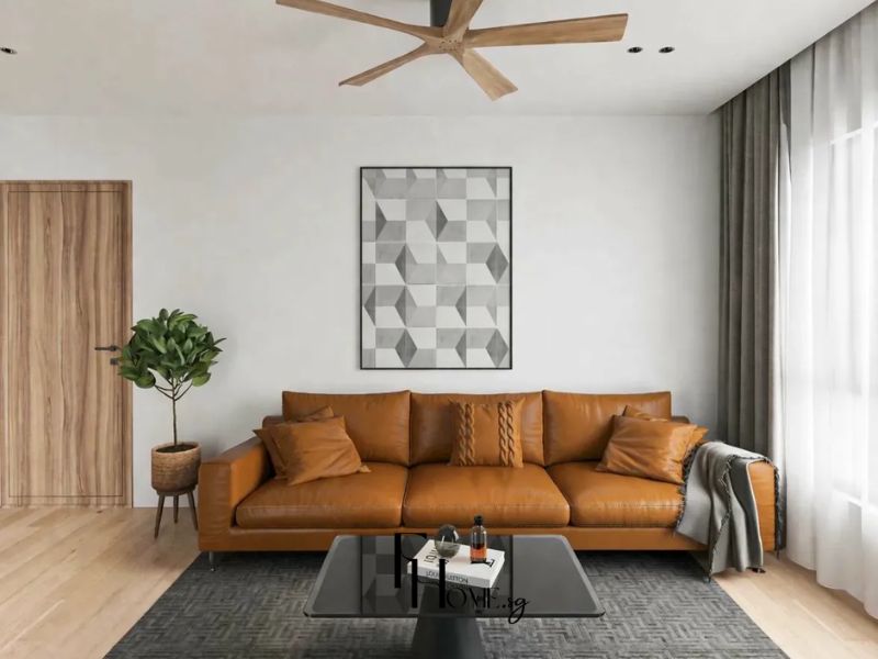 Thiết kế nội thất phong khách căn hộ chung cư 70m2 phong cách Tối giản sofa da nâu cognac, bàn trà kính đen, thảm xám vân xương cá, quạt trần cánh gỗ 