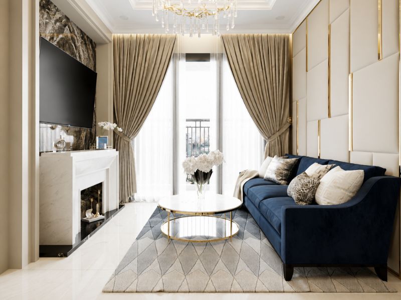 thiết kế nội thất phòng khách căn hộ 85m2 sofa xanh bàn trà tròn