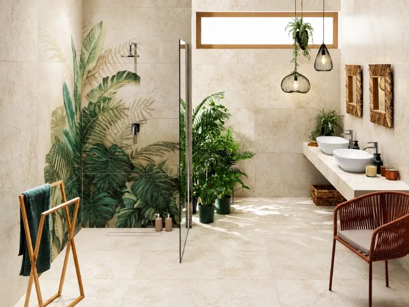 Phòng tắm phong cách Tropical với cây xanh, vách kính và tủ lavabo trắng.