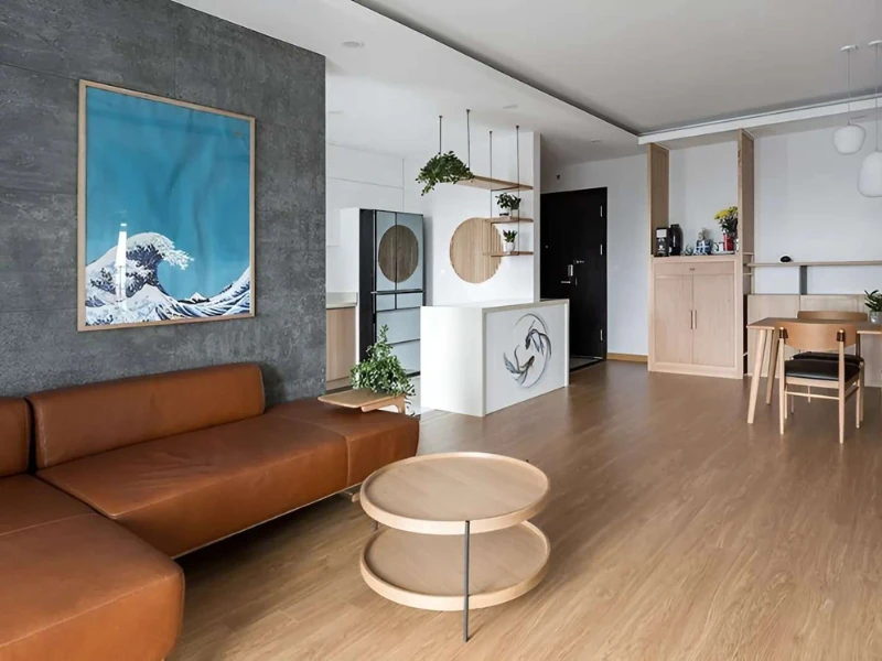 Phòng khách chung cư tối giản với sofa nâu và cách bố trí không gian mở