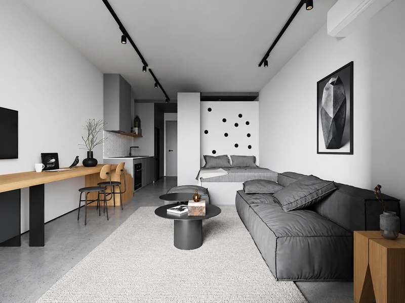 Phòng khách chung cư 25m2 với sofa xám, bàn trà đen, bàn làm việc gỗ và giường nằm góc tường