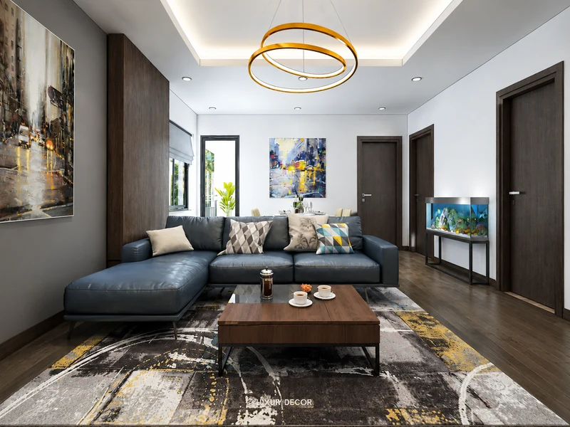 Phòng khách chung cư 50m2 với sofa da xanh, bàn trà gỗ, thảm trừu tượng và bể cá.