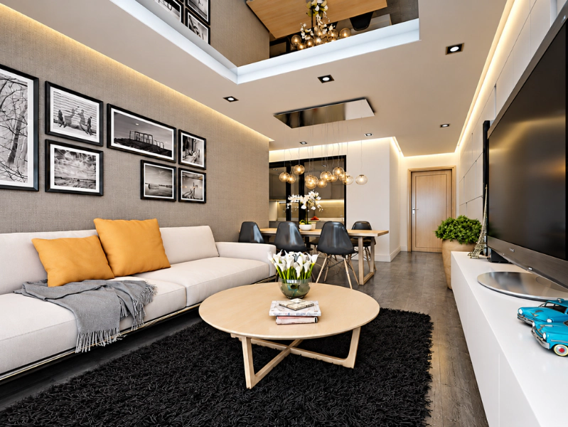 Phòng khách chung cư cho thuê với sofa xám và gối vàng nổi bật