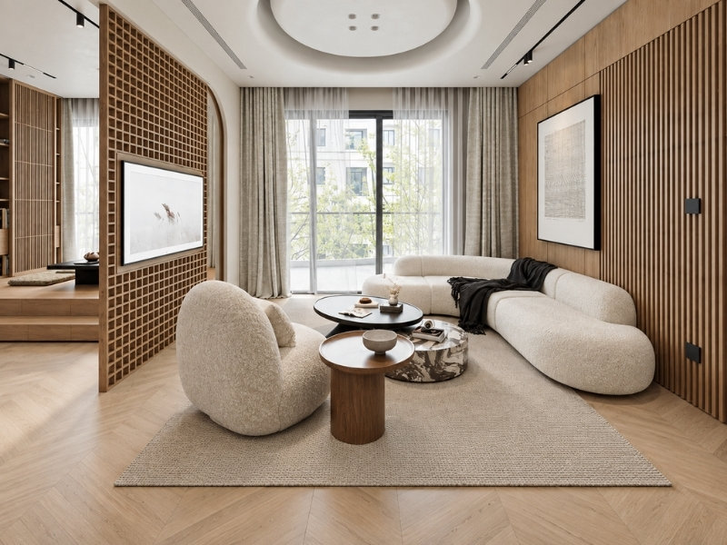 Phòng khách tông trắng be với sofa cong, vách gỗ và cửa sổ lớn