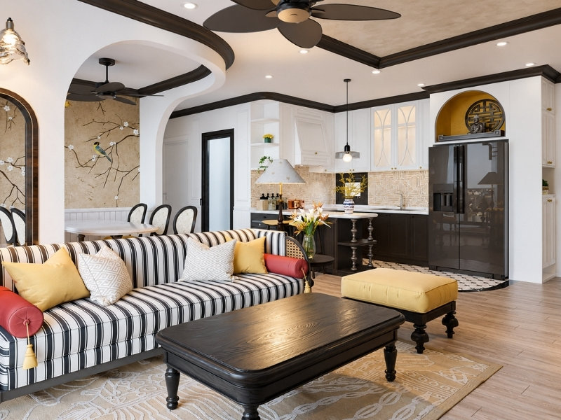 Phòng khách liền bếp Indochine với sofa sọc, gỗ tối màu và họa tiết nhiệt đới