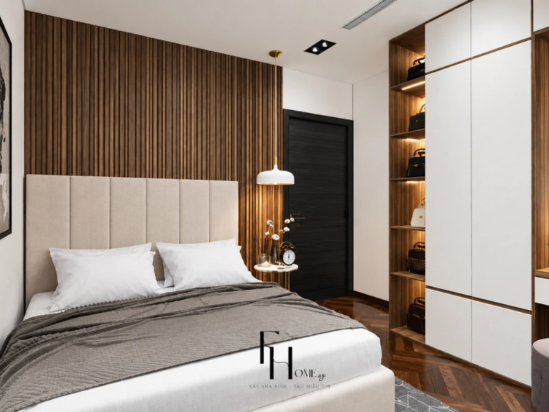Phòng ngủ chung cư 80m2 với vách nan gỗ và tủ áo trắng