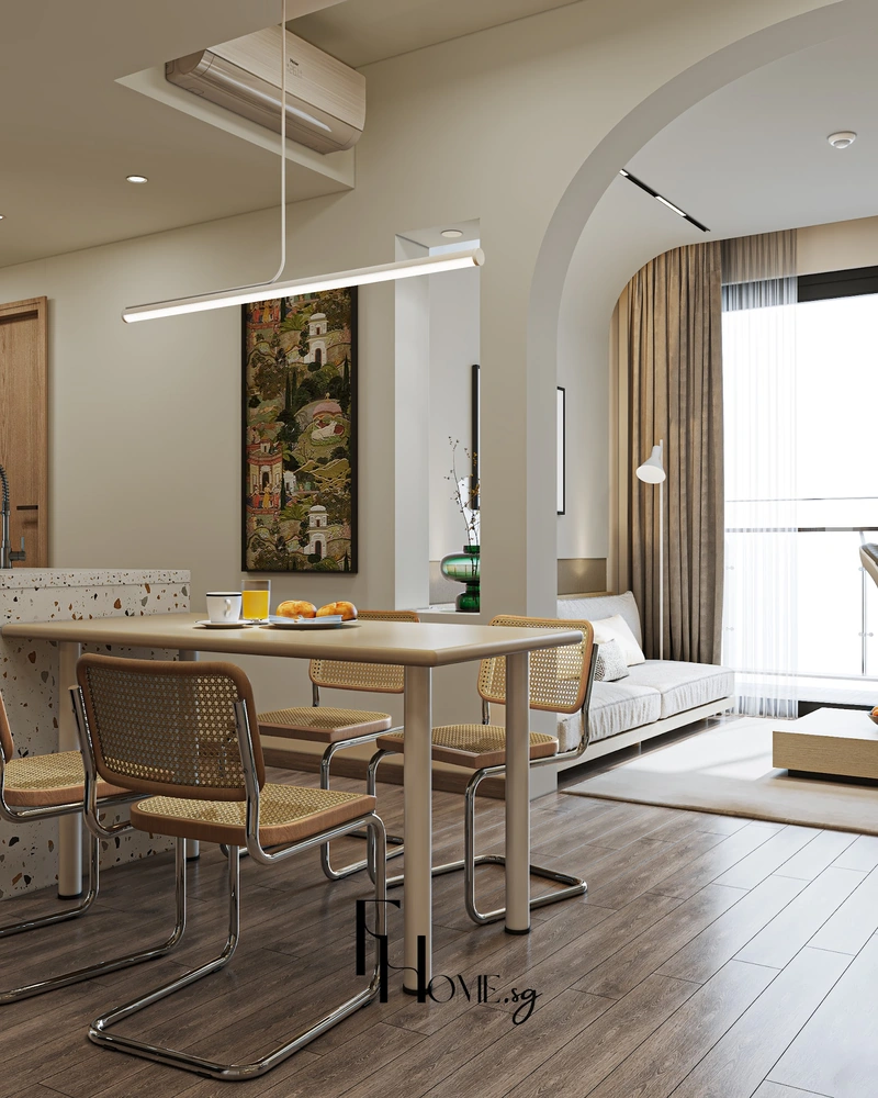 Bàn ăn cùng ghế mây đặt cạnh vòm cong nhìn sang khu sofa