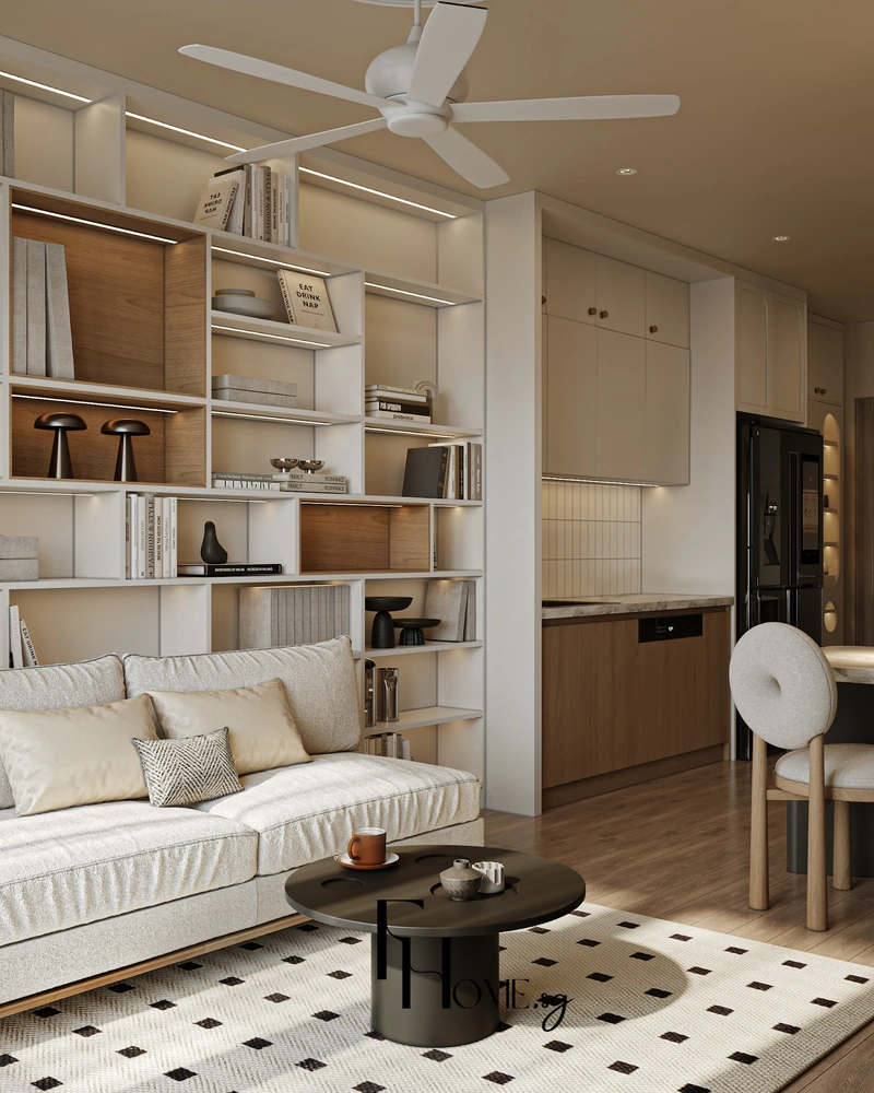 Kệ sách trắng cao sát trần sau sofa kem nhìn sang khu bếp mở