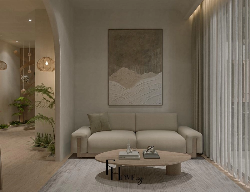 Sofa be dưới bức tranh núi cạnh vòm cong và chậu cây trong phòng khách