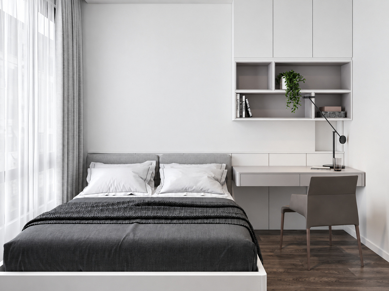 Phòng ngủ căn hộ 60m2 một phòng ngủ với giường đen và bàn làm việc