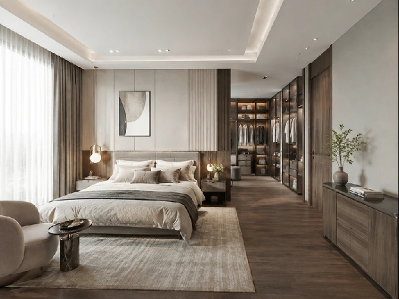 Giường bọc nệm ở phía trước và lối mở dẫn vào dãy tủ áo phía sau