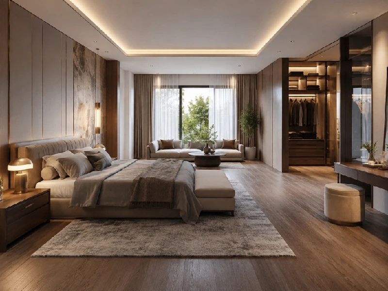 Phòng ngủ master rộng với sofa ở cuối giường và khu tủ áo phía sau vách