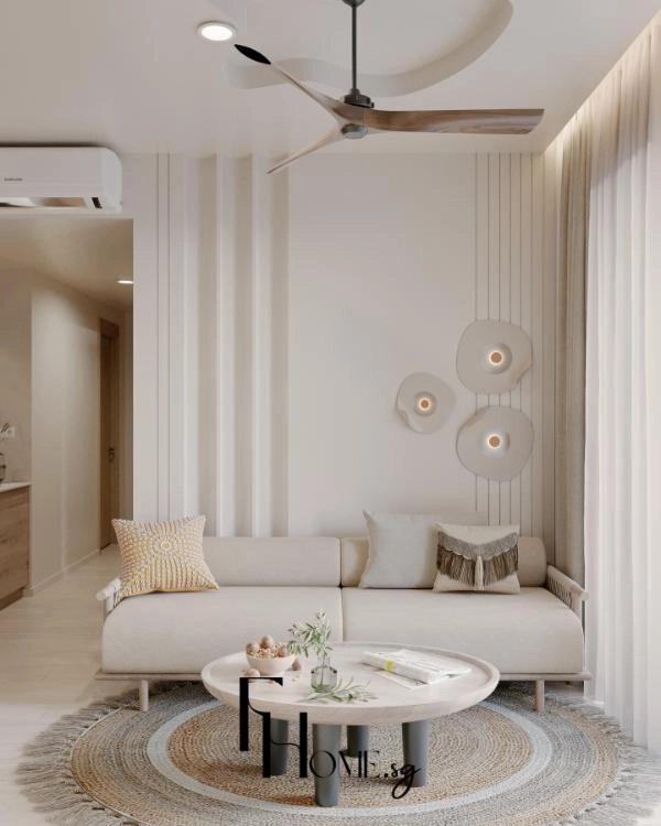 Sofa vải màu be bàn trà tròn và thảm sợi tự nhiên giữa phòng khách