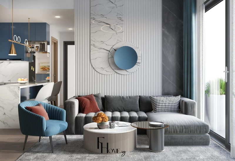 Sofa xám trước vách ốp có tấm đá vân mây và mảng tròn xanh