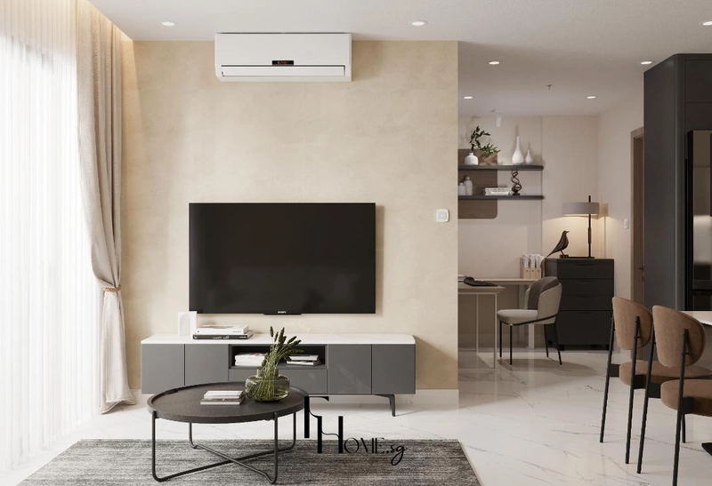 Tường tivi màu be với kệ ghi thấp bàn trà tròn và góc làm việc